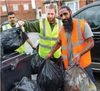  ??  ?? Attacked: Naveed Sadiq, right, and volunteers