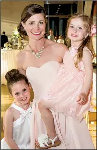  ??  ?? Jessica Stull of Paw Paw, Mich., with her daughters Charlotte and Caroline