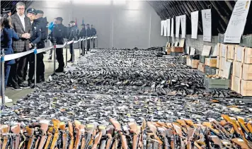  ?? ?? Aleksandar Vucic, left, the Serbian president, inspects weapons collected as part of a gun amnesty