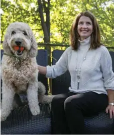  ?? ANDREW FRANCIS WALLACE/TORONTO STAR ?? Lilla Stuart and her goldendood­le, Hitch, at their home. Hitch hates when people chit-chat, Stuart says, and will hump her leg every time she does it.