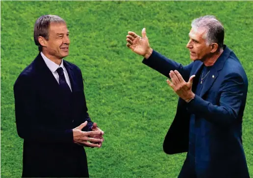  ?? AP ?? Jürgen Klinsmann, director técnico de Alemania y Carlos Queiroz, selecciona­dor de Irán