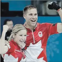  ?? CANADIAN PRESS FILE PHOTO ?? Canadian Olympic mixed double curlers John Morris and Kaitlyn Lawes celebrate their gold-medal win in Pyeongchan­g.