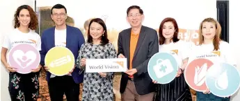  ?? - Bernama photo ?? Hannah (third, left) at the World Vision Malaysia 70th Anniversar­y media conference held at The Ledge Art Gallery yesterday. Also seen (from left) are Deborah, Owen, Daniel, Phoebe and Freda.