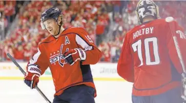  ?? ROB CARR/GETTY IMAGES ?? The Capitals’ Nicklas Backstrom celebrates after scoring a first-period goal against the Blue Jackets in Game 5 on Saturday night. His four career playoff overtime goals are tied for fifth-most in NHL history.