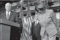  ?? AP/ ANDREW HARNIK ?? House Minority Whip Steny Hoyer ( left), accompanie­d by House Minority Leader Nancy Pelosi and other Democrats, speaks Thursday after the health care bill passed in the House.