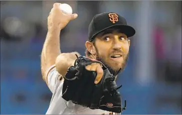  ?? Mark J. Terrill Associated Press ?? THERE COULD BE some trouble if the San Francisco Giants use a reliever to open one of Madison Bumgarner’s starts. In a text message to his manager, the ace said he would walk out of the ballpark if it happened.