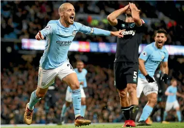  ?? PHOTOS: GETTY IMAGES ?? Manchester City’s David Silva celebrates scoring against West Ham as their total dominance of the EPL continues.