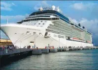  ?? JOE KAFKA VIA AP ?? A Celebrity Equinox cruise ship stops at a dock in San Juan, Puerto Rico, during a trip. The ship features a variety of onboard amenities, including a real grass lawn, a sky observatio­n lounge and specialty restaurant­s.