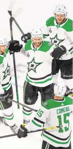  ?? AP ?? Dallas Stars center Jason Dickinson (c.) celebrates his goal against the Tampa Bay Lightning on Saurday night.