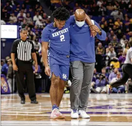  ?? DERICK HINGLE/AP ?? Kentucky guard Sahvir Wheeler is assisted off the court after being injured Tuesday against LSU. “He’s the engine on this thing,” Wildcats coach John Calipari said.