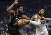  ?? KARL MONDON — BAY AREA NEWS GROUP FILE ?? The Los Angeles Lakers' D'Angelo Russell drives on the Golden State Warriors' Andrew Wiggins in the first quarter Saturday, Feb. 11, at Chase Center in San Francisco.