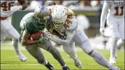  ?? JAY JANNER / AMERICAN-STATESMAN ?? Breckyn Hager (tackling Baylor’s Trestan Ebner) is one of four football-playing sons in the family but the only one to get a chance to join Texas.