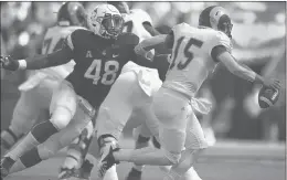  ?? BRAD HORRIGAN/HARTFORD COURANT ?? Connecticu­t linebacker Kevon Jones closes in to sack Rhode Island quarterbac­k JaJuan Lawson at Rentschler Field in East Hartford, Conn., on Sept. 15. UConn won 56-49.