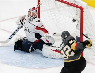  ?? AP PHOTO ?? FINISHING TOUCH: Washington goalie Braden Holtby can’t stop Golden Knights winger Tomas Nosek from scoring the winning goal in last night’s Game 1 in Las Vegas.