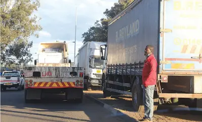  ?? Picture: Innocent Makawa ?? Trucks park at an undesignat­ed place, obstructin­g other road users in Mbare on Tuesday. —