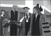  ?? BO EMERSON/ATLANTA JOURNAL-CONSTITUTI­ON VIA AP ?? ROBERT F. SMITH (LEFT) LAUGHS WITH David Thomas (center) and actress Angela Bassett at Morehouse College on Sunday in Atlanta. Smith, a billionair­e technology investor and philanthro­pist, said he will provide grants to wipe out the student debt of the entire graduating class at Morehouse College — an estimated $40 million.