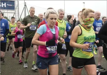  ??  ?? Runners gather pace at the start of the race.