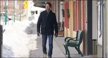  ?? Associated Press ?? Shelby Rognstad, a Democrat who is mayor of Sandpoint, Idaho, walks last month in downtown Sandpoint. Rognstad, who is running for governor, worries about the trend of a growing number of real estate companies advertisin­g to conservati­ves.