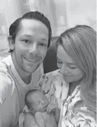  ??  ?? Tim and Blair Bringardne­r hold son Blaine Matthew Bringardne­r, born on Feb. 26 in Oakland, California. He was the fourth of four grandchild­ren that the Bringardne­rs welcomed last week.