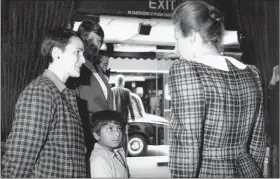  ??  ?? Gautam Lewis with his adoptive mother Patricia and Princess Anne (R)