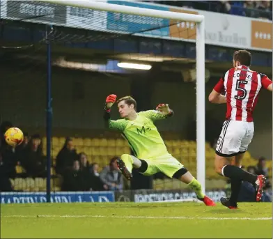  ??  ?? COOL: Jack O’Connell calmly slots home sheffield United’s second just before half-time