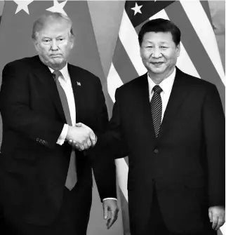  ?? PHOTO: REUTERS ?? US President Donald Trump ( left) with China’s President Xi Jinping. The US depends heavily on China for providing the low-cost goods that enable income-constraine­d American consumers to make ends meet