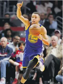  ?? SEAN M. HAFFEY/GETTY IMAGES ?? Stephen Curry of the Golden State Warriors is averaging 32.7 points per game with the Warriors off to a 15-0 start, which he described as “a huge accomplish­ment.”