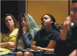  ??  ?? Top, civil rights icon Minnijean Brown-Trickey of the Little Rock Nine speaks onstage to students at San Mateo’s Aragon High School. Above, students Sydney Jackson (right) and Jenn Dixon (center) and director of student activities Melissa Perino listen...