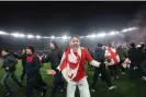  ?? Images ?? Georgia fans celebrate after invading the pitch following their team’s shootout win over Greece. Photograph: Giorgi Arjevanidz­e/AFP/Getty