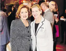  ?? MARC MURI ?? MONOCHROMA­TIC CHIC: Helen Grivakis and pal Suzanne Rouleau attend the 50th Anniversar­y Centaur Soirée.