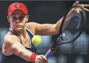  ?? AndyWong / Associated Press ?? Ashleigh Barty hits a backhand shot against Karolina Pliskova during the WTA Finals Tournament on Saturday.