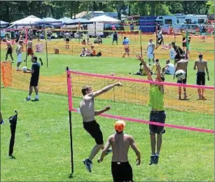  ??  ?? At right, the Pottstown Rumble has grown to the biggest grass volleyball tournament in the rnited ptates. Players compete on courts set up in Memorial Park.