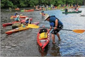  ??  ?? Kayakers get ready to paddle the stretch from Amty Township to Pottstown last week as part of the Schuylkill River Sojourn.