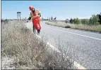  ?? STAFF FILE PHOTO ?? Sam Wang picks up litter along a Highway 85 on-ramp. Plastic bottle caps are one of the most common items discarded by California­ns.