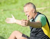  ?? PHOTO BY ASHLEY ANGUIN ?? Reggae Boyz coach Heimir Hallgrimss­on addresses players during a practice game against Montego Bay United at Wespow Park in Montego Bay on February 15.