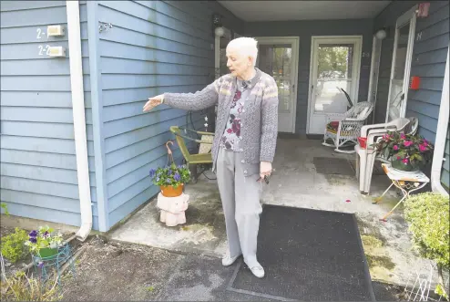  ?? Krista Benson / Hearst Connecticu­t Media ?? Brooks Quarry resident Barbara Locke in front of her apartment in the Brookfield affordable housing complex on May 2. The complex is in need of various upgrades. The Brookfield Housing Authority has set up a nonprofit, Friends of Brooks Quarry, to raise money for these upgrades and to get the housing authority in better financial shape. Below at left, Michael Steele, left, chairman of the Brookfield Housing Authority, along with Brooks Quarry resident and Tenant Commission­er Jo-Ann Gargiulo, discuss the complex.