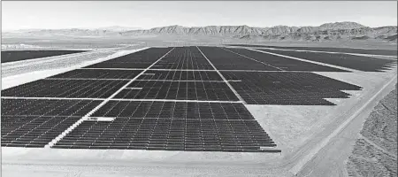  ?? MICHAEL QUINE/LAS VEGAS REVIEW-JOURNAL ?? Solar arrays line the desert floor of the Dry Lake Solar Energy Zone as part of the 179 megawatt solar projects north of Las Vegas, Nev.