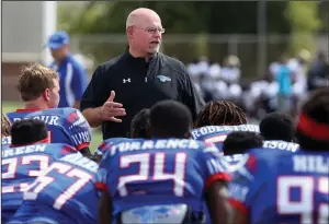  ?? (HutchNews/Sandra J. Milburn) ?? Former Hutchinson Community College Coach Rion Rhoades, here talking to his players after a 2019 game, said it didn’t take him long to accept an offer to become linebacker­s coach at the University of Arkansas in December. “It was an easy decision,” Rhoades said.
