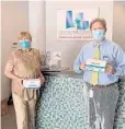  ??  ?? Bank of America recently donated 340,000 face masks to 16 nonprofits in South Florida. Greater Fort Lauderdale Chamber of Commerce Executive Vice President Carolyn Michaels and President and CEO Dan Lindblade show some of the donated PPE.