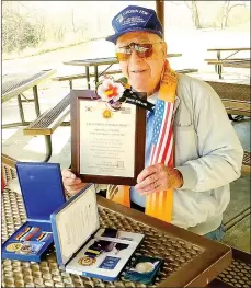  ?? Lynn Atkins/The Weekly Vista ?? Milt Walker, a survivor of the “most harrowing battle of the Korean War,” displays the medals he received during a recent visit to Korea. The 70-year anniversar­y of the Chosin Reservoir Campaign is this month.