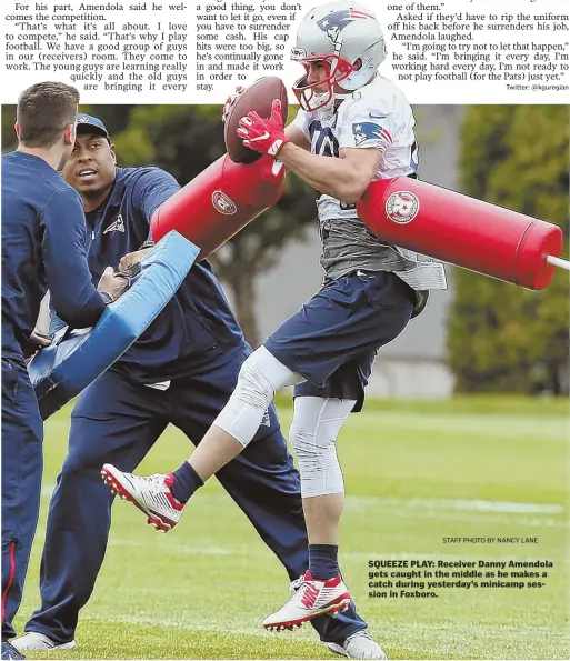  ?? STAFF PHOTO BY NANCY LANE ?? SQUEEZE PLAY: Receiver Danny Amendola gets caught in the middle as he makes a catch during yesterday’s minicamp session in Foxboro.