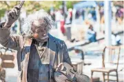  ?? CLARK WHITE ?? A performer made up to look like a statue was part of the entertainm­ent at last year’s festival in Prescott.