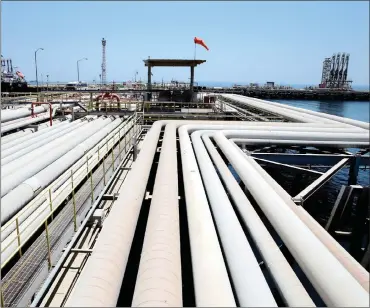  ?? PHOTO: REUTERS ?? An oil tanker being loaded at Saudi Aramco’s Ras Tanura oil refinery and oil terminal in Saudi Arabia. As supply losses in Opec pile up, its biggest producer, Saudi Arabia, is trying to plug the gap.