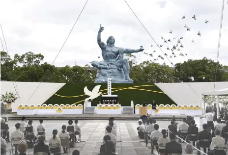  ??  ?? Doves are released at a ceremony at Nagasaki Peace Park to mark the 75th anniversar­y of the world’s second atomic bomb attack