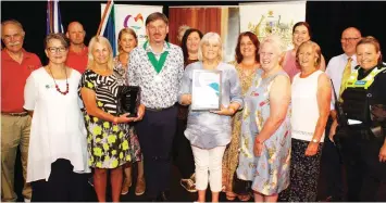  ?? ?? Accepting Baw Baw Soup Kitchen’s community group of the year award on Australia Day are (from left) Ian Inglis, deputy mayor Annemarie McCabe, Michael Stephenson, Jan Davidson, Carmel Parker, mayor Michael Leaney, Sharon Ramsay, Jan Morton, Krista Mountford, Leisa Stanford, Tahlia Ramm, Val Borg, Member for Narracan Gary Blackwood and acting sergeant Paula Fowler.