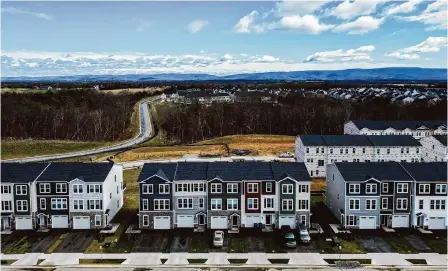  ?? Photos by Julia Nikhinson/for the Washington Post ?? Townhomes, such as these in Frederick County, Va., are growing in popularity as buyers are priced out of spacious single-family homes.