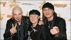  ?? JO HALE / GETTY IMAGES ?? Rudolf Schenker (from left), Klaus Meine and MatthiasJa­bs of the Scorpions win the Metal Guru Award at the 2011 Classic Rock Awards to honor rock’s biggest icons at the Roundhouse in London. The band will perform on Wednesday night at the Seminole Hard Rock Hotel &amp; Casino’s Hard Rock Event Center in Hollywood.