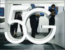  ?? NG HAN GUAN — THE ASSOCIATED PRESS ARCHIVES ?? A true U.S. mobile rollout of 5G wireless began in 2019, but significan­tly faster networks are still sparse.