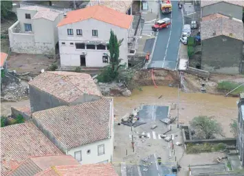  ?? — AFP ?? An aerial view shows a collapsed bridge in the city of Villegailh­enc, near Carcassonn­e, southern France, on Monday.