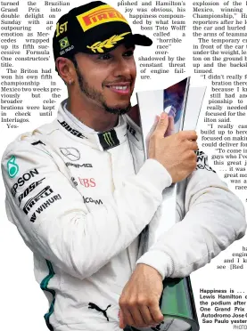  ?? PHOTO: GETTY IMAGES ?? Happiness is . . . Race winner Lewis Hamilton celebrates on the podium after the Formula One Grand Prix of Brazil at Autodromo Jose Carlos Pace in Sao Paulo yesterday.